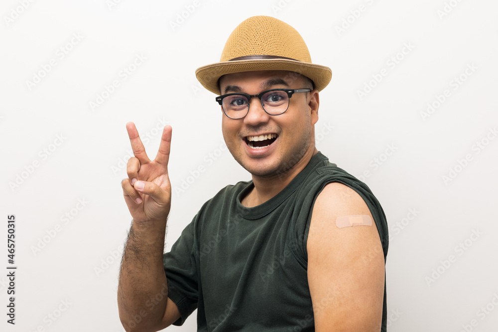 Vaccinated asian man with hat showing arm after coronavirus Vaccination isolated white Background. Indian man getting a vaccination covid-19 immunization Vaccinated asian man with hat showing arm after coronavirus Vaccination isolated white Background. Indian man getting a vaccination covid-19 immunization
