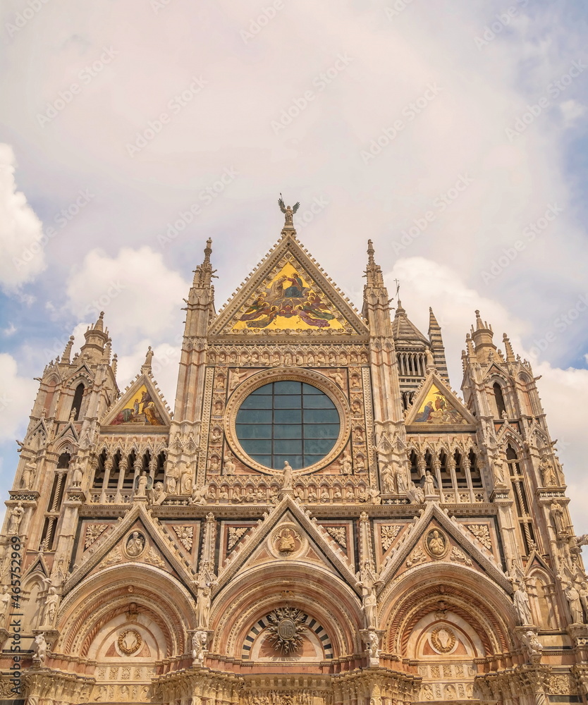 Fragment of the Cathedral with sculptures on the facade in Siena