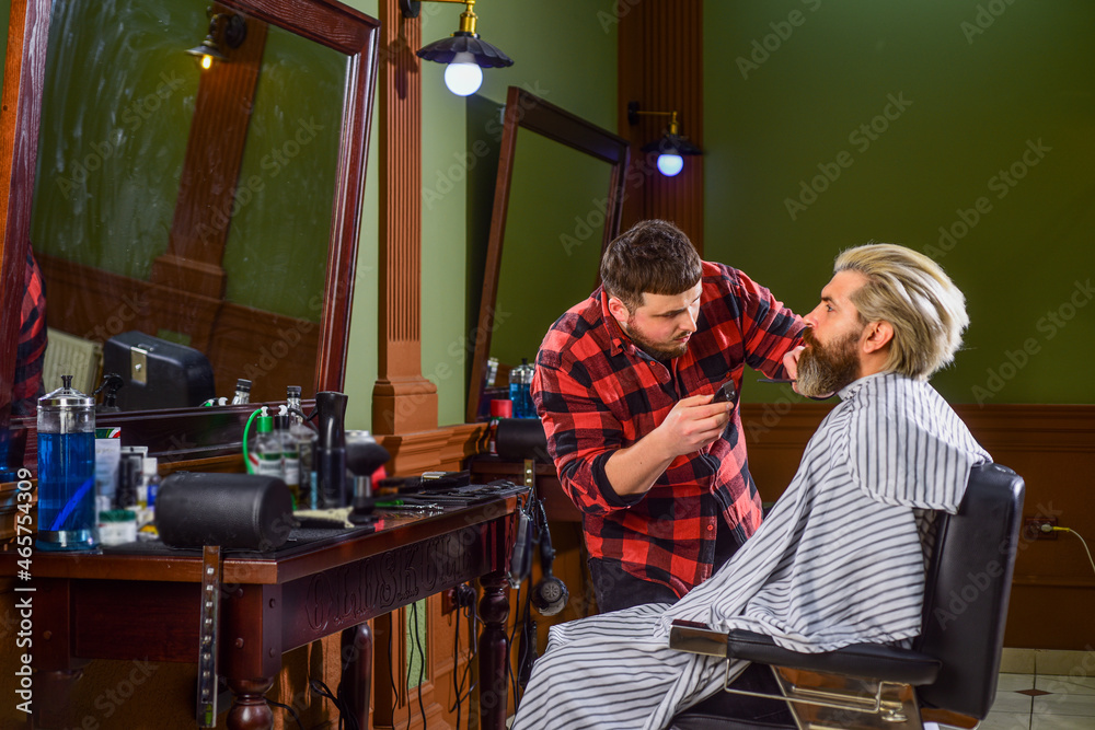 Fototapeta premium hipster with dyed beard and moustache. man want new hairstyle. male beauty and fashion. mature man at barbershop. bearded man at hairdresser. professional barber with male client. Hair like fire