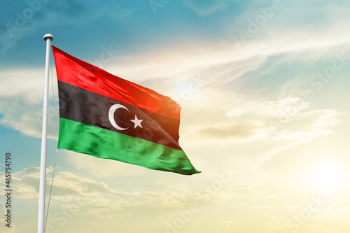 Libya national flag cloth fabric waving on the sky - Image photo