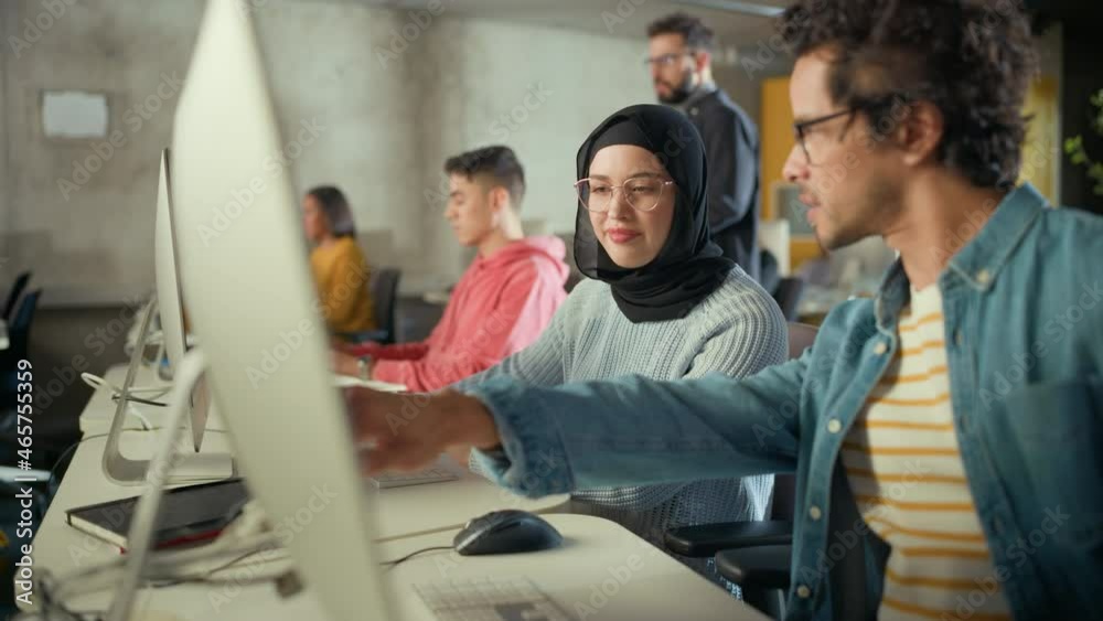 Female Muslim Student Wearing Hijab, Studying in Modern University with Diverse Multiethnic Classmates. She Asks Scholar a Question in College Room. Lecturer Shares Knowledge with Smart Scholars.