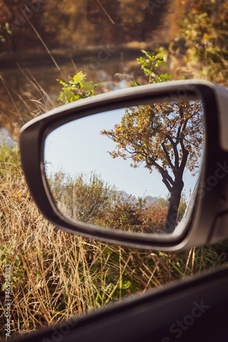 Autumn in the car mirror