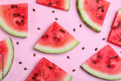 Delicious ripe watermelon on pink background, flat lay