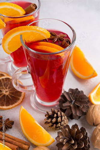 Mugs of mulled wine. Ingredients for a cocktail. Hot winter drinks based on sparkling wine.