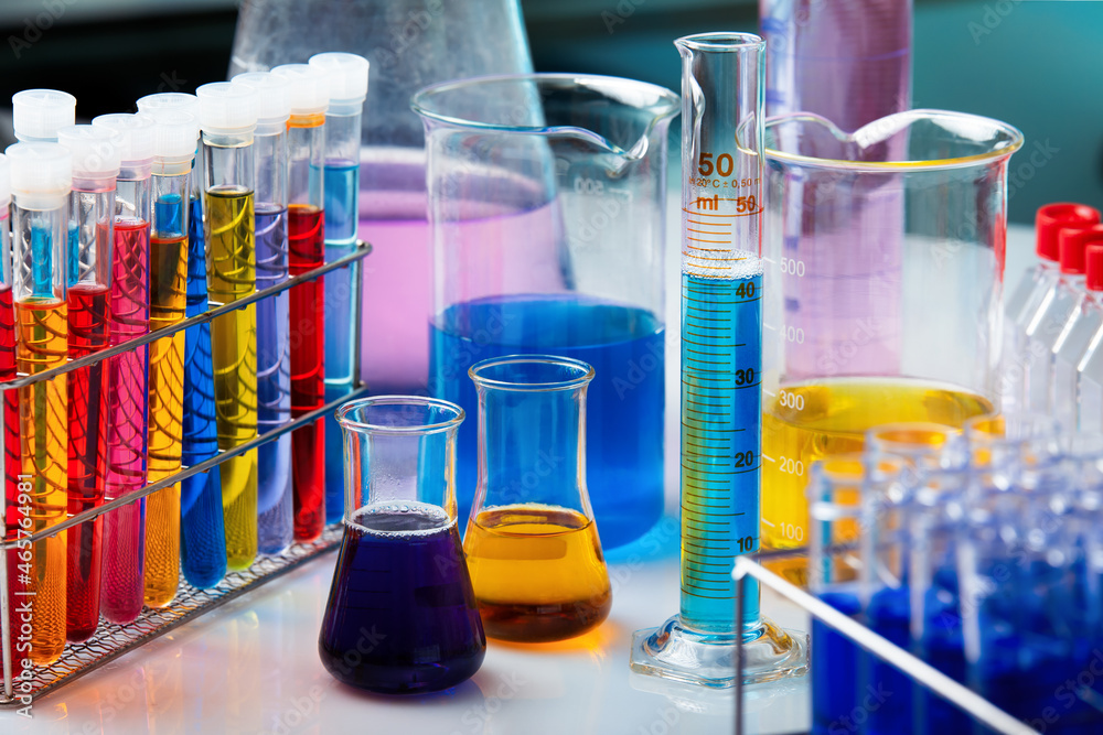 Work table of chemistry lab with glassware and measurement. Workbench with Test tubes in Research laboratory for development of experiments Work table of chemistry lab with glassware and measurement. Workbench with Test tubes in Research laboratory for development of experiments