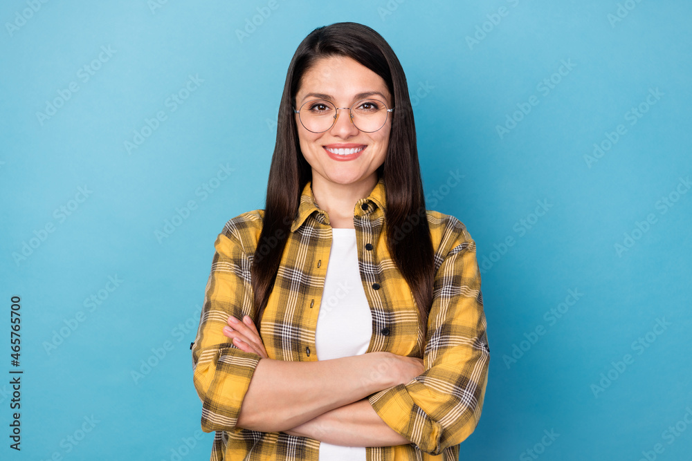 Photo of mature attractive business woman happy positive smile confident crossed hands isolated over blue color background Photo of mature attractive business woman happy positive smile confident crossed hands isolated over blue color background