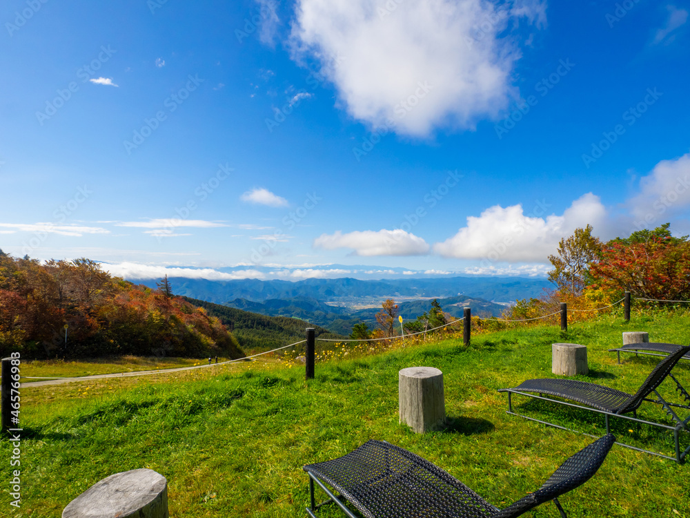 Viewing platform overlooking autumnal mountains and town (Zao, Yamagata, Japan)