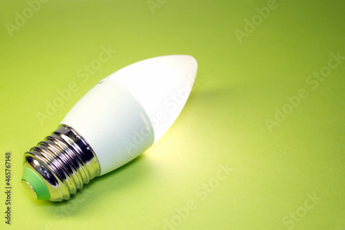 burning LED lamp on a green table without connection