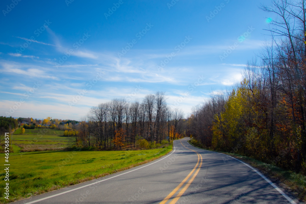 Fall colors in the Canadian countryside with road in the province of Quebec