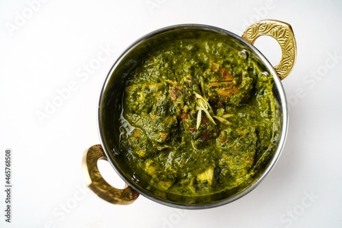 Homemade Palak chicken isolated on white photo