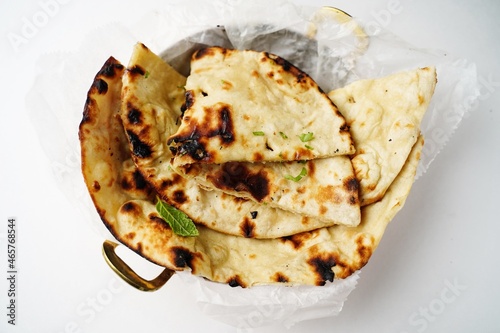 Slika na platnu Fresh Tandoori Roti or Butter Naan isolated on white, selective focus