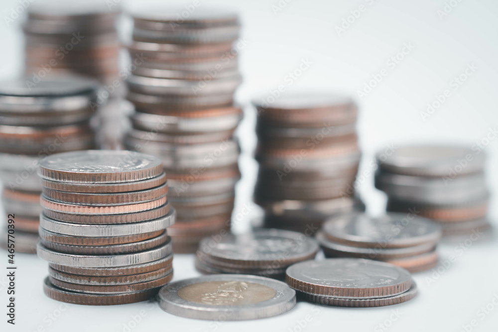 money coins to stack of coins.Saving money for future use concept and money financial business growth concept. isolated on white background money coins to stack of coins.Saving money for future use concept and money financial business growth concept. isolated on white background