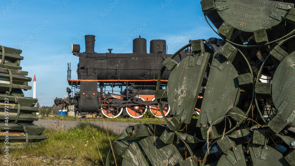 Obraz premium Retro Soviet steam locomotive. Veteran railways. Vintage black steam locomotive train rush railway.
