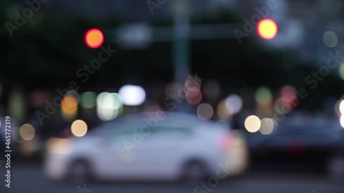 Soft focus lights moving in a night time city setting