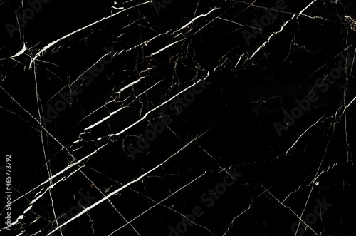 Black marble, patterned background texture.