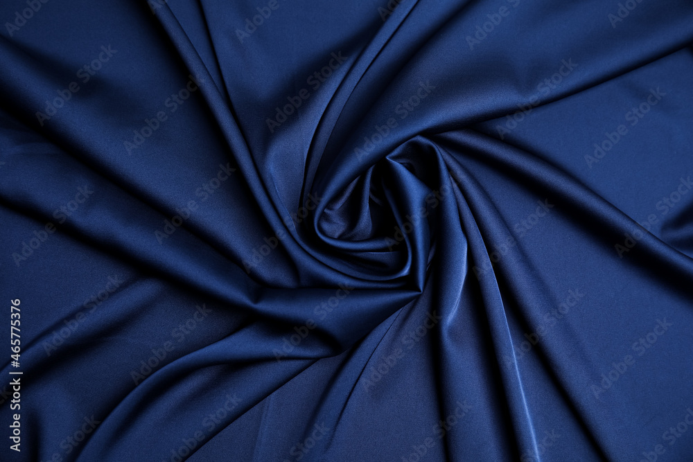 Crumpled dark blue silk fabric as background, top view Crumpled dark blue silk fabric as background, top view