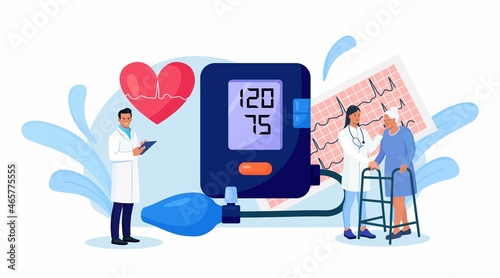 Hypotension, hypertension disease. Tiny cardiologist measuring high blood pressure with tonometer. Doctor consulting elderly patient about cardiological disease Medical examination, cardiology checkup