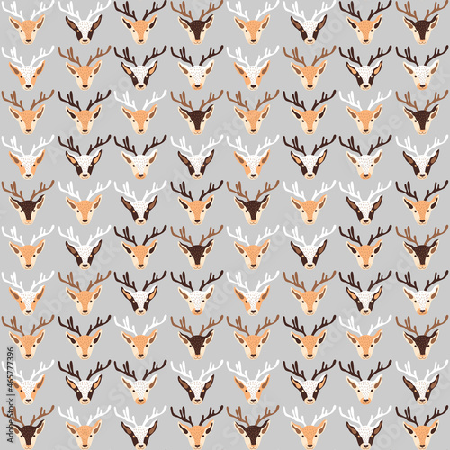 Christmas pattern with heads of reindeers on grey background. Vector illustration 