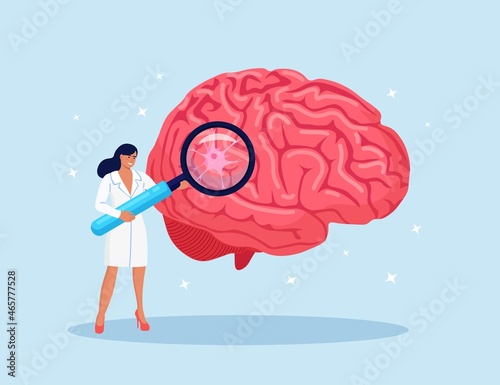 Laboratory scientist study human brain by magnifying glass. Head Tomography. Doctor diagnoses of alzheimer and dementia disease, memory loss problem. Researching in neurology, psychiatry, stroke. 