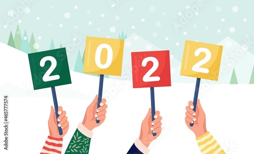 Happy people hold signs or placard with numbers 2022 in hands. Group of friends wish Merry Christmas and happy New Year. Holiday greeting. Cheerful people celebrating xmas. Vector design