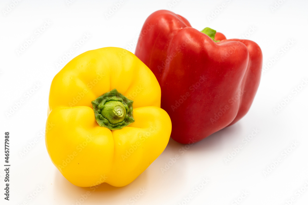 Yellow and red bell peppers on white background with shadow. close up Yellow and red bell peppers on white background with shadow. close up