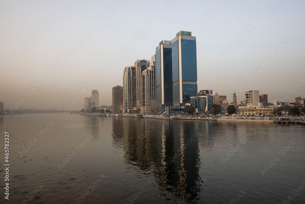 Obraz premium reflection of modern buildings in the Nile of Cairo Egypt