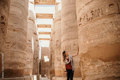 Female Traveler exploring ancient Karnak Temple in Luxor Egypt