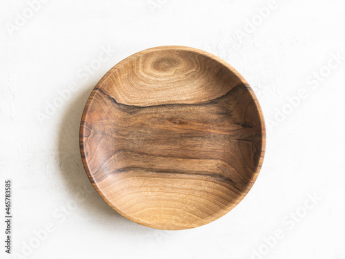 Round wooden craft plate mockup for eco, food or beauty product on white background.