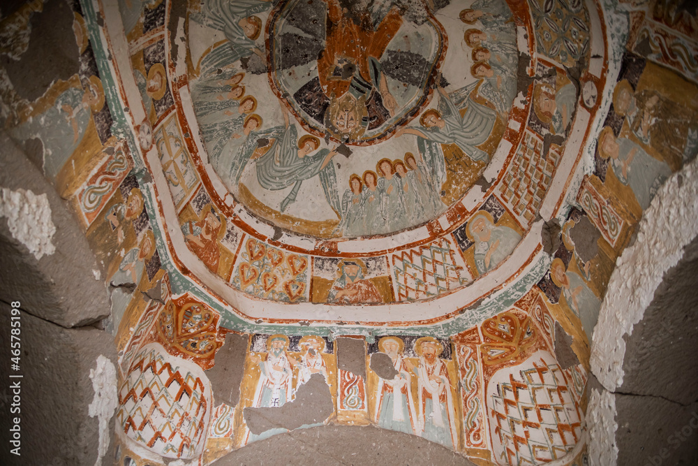 ancient colorful paintings in a cave church in Turkey