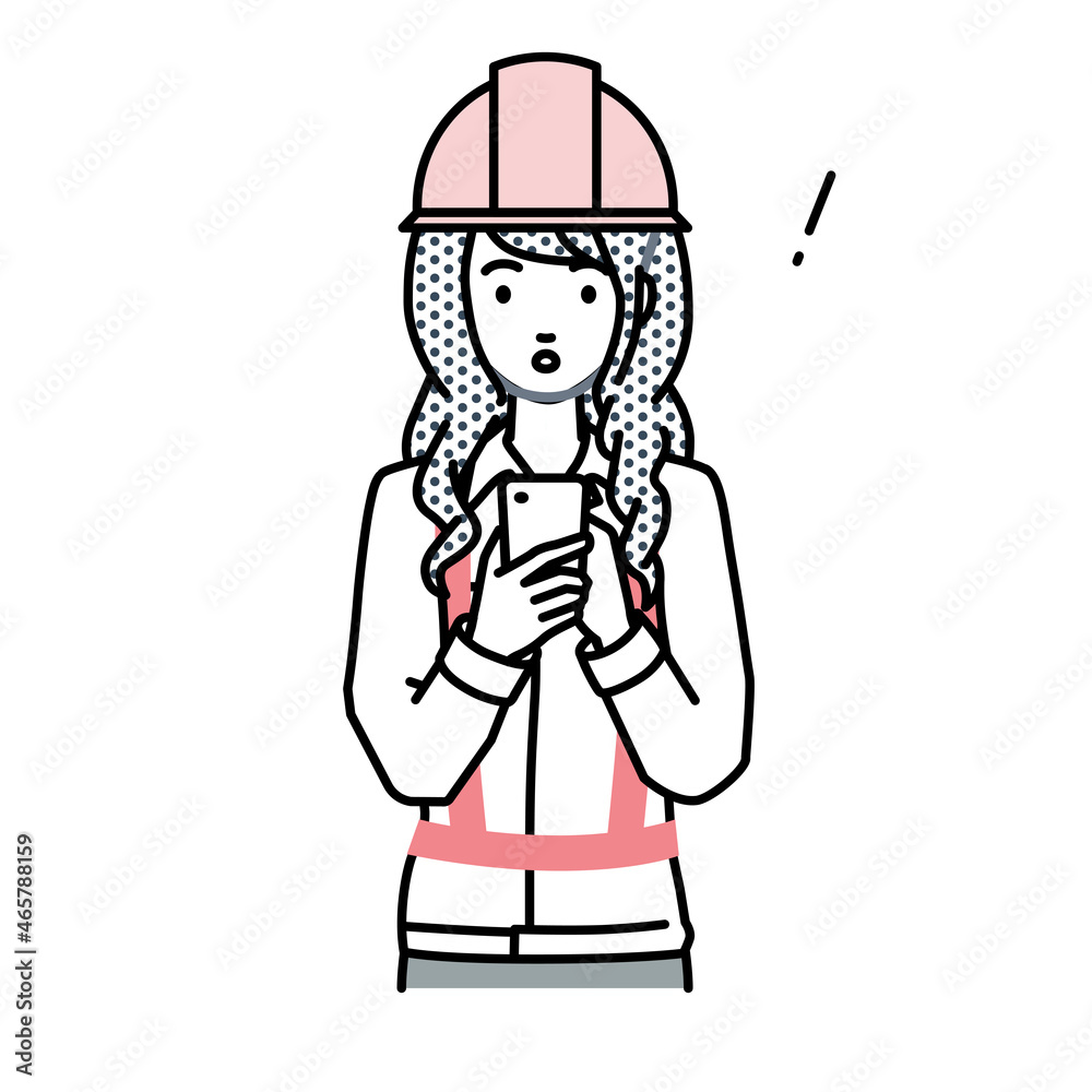 立ってスマートフォンを操作して何かに気づいて驚いた工事現場の女性