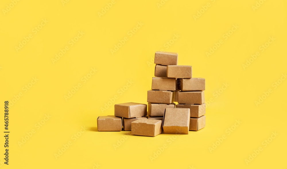 Business ecommerce or online shopping concepts with group of product box order on yellow color background.