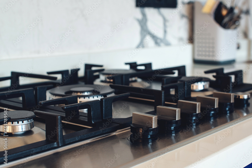 Kitchen gas stove, close up. New gas stove appliance and countertop