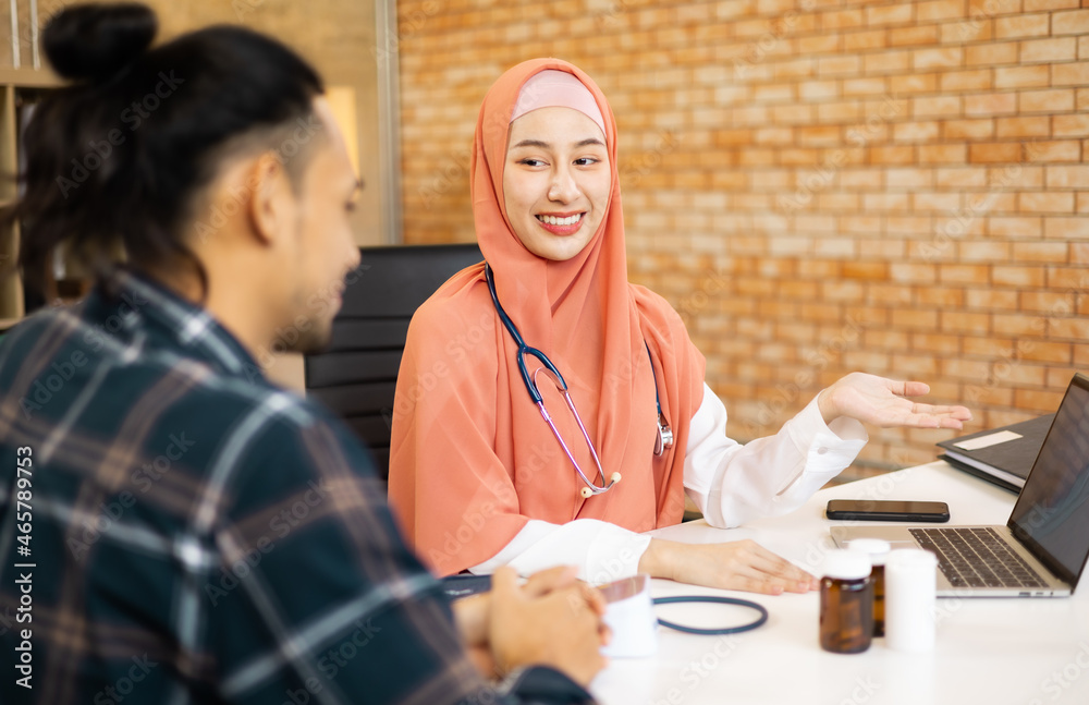 Muslim asian woman doctor service help support discussing and consulting talk to patient and check up information at meeting health medical care. Muslim asian woman doctor service help support discussing and consulting talk to patient and check up information at meeting health medical care.