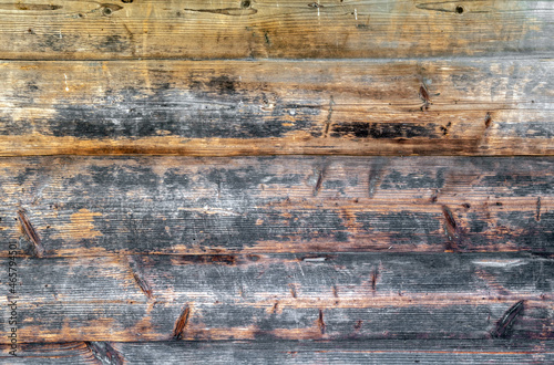 Background from old wooden boards with an interesting texture. Textured wood pattern. Photos of boards fitted to each other.