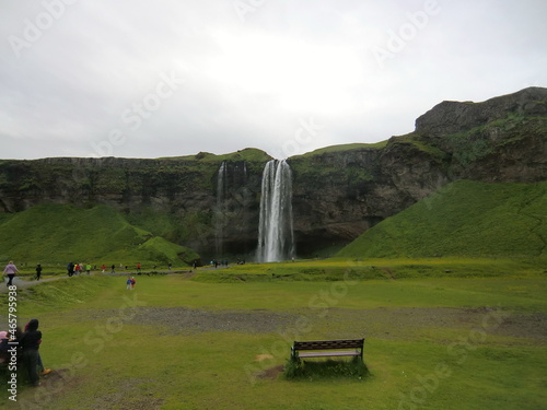 At the foot of the waterfall in Seljalandsfoss, Iceland