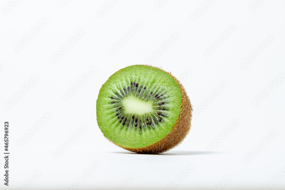 Isolated kiwi on a white background. Ripe and tasty kiwi. Kiwi cutaway Isolated kiwi on a white background. Ripe and tasty kiwi. Kiwi cutaway