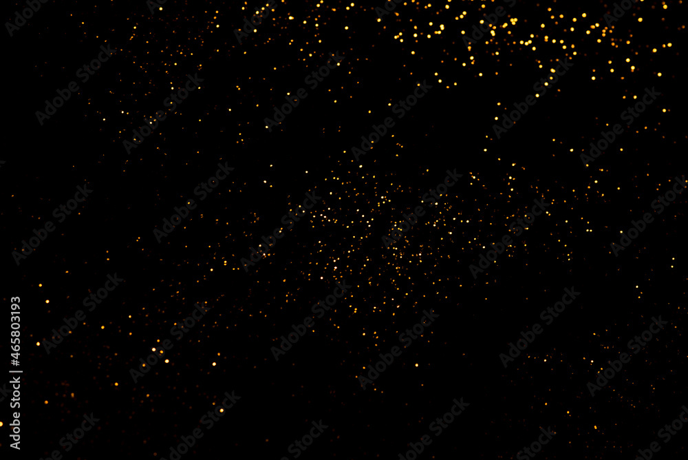 Golden abstract bokeh on black background. Golden abstract bokeh on black background.