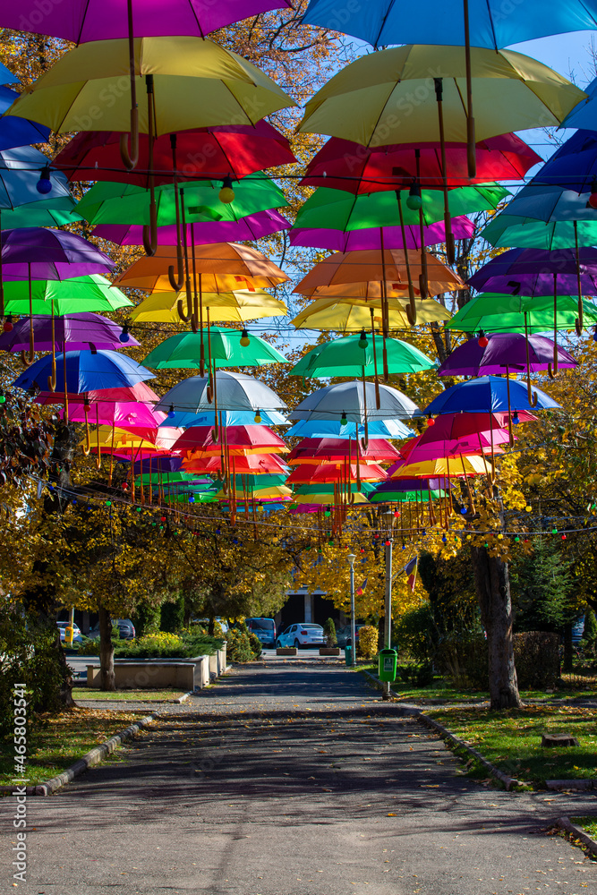 An alley with hanging umbrellas in the municipal park in Reghin city - Romania 26.Oct.2021