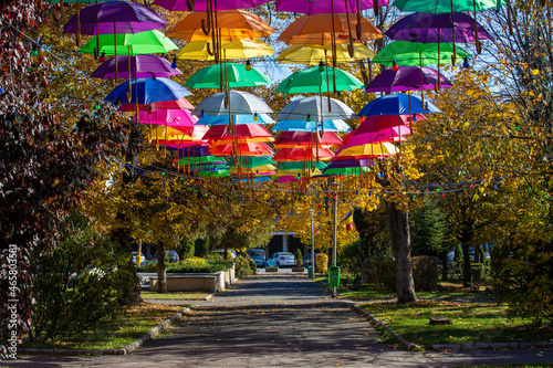 An alley with hanging umbrellas in the municipal park in Reghin city - Romania 26.Oct.2021