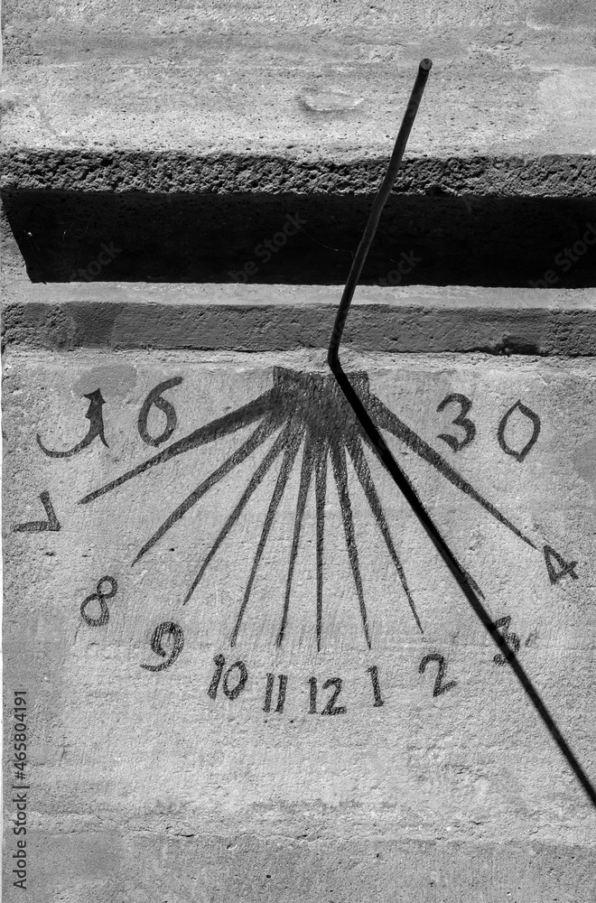 an old sundial on the wall