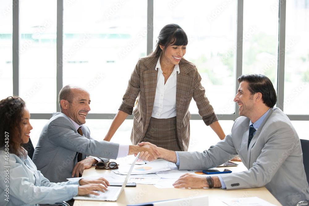 businessman working and shaking hands together for success a job in meeting room