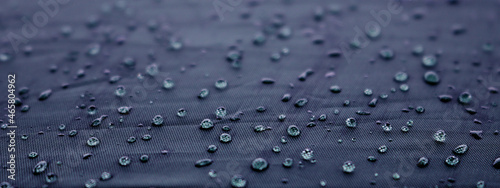 Blurred water drops on blue dark texture background texture