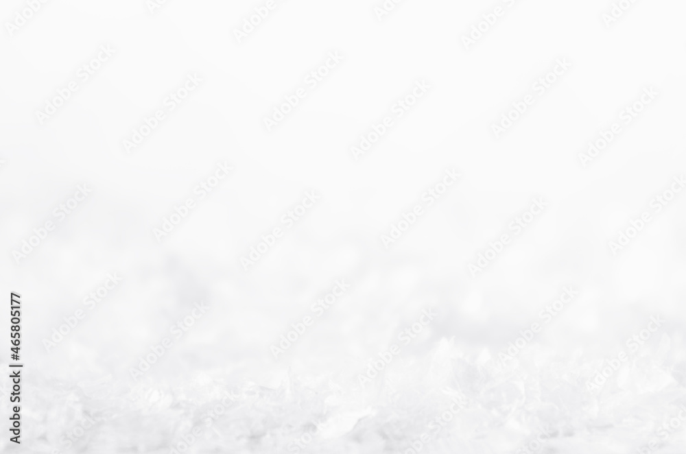 Obraz premium Christmas white frosty shiny bright snowflakes with blur band, surface of fake snow as abstract winter background, texture, closeup.