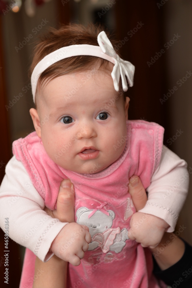 cute little baby girl with a beautiful white bow cute little baby girl with a beautiful white bow