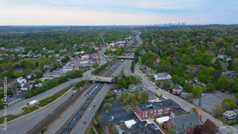 West Newton and Interstate Highway 90 I-90 aerial view at Exit 125 with Boston modern skyline at the background in city of Newton, Massachusetts MA, USA. West Newton and Interstate Highway 90 I-90 aerial view at Exit 125 with Boston modern skyline at the background in city of Newton, Massachusetts MA, USA.