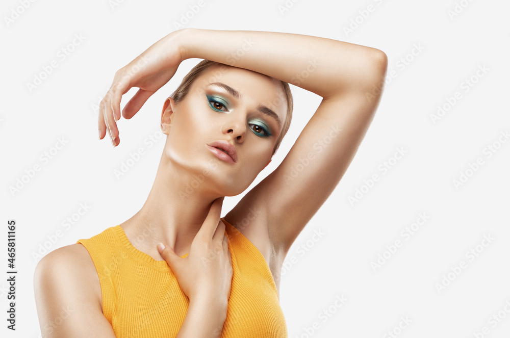 Portrait of attractive girl with healthy clean skin and beautiful make-up. Aesthetic cosmetology and makeup concept.