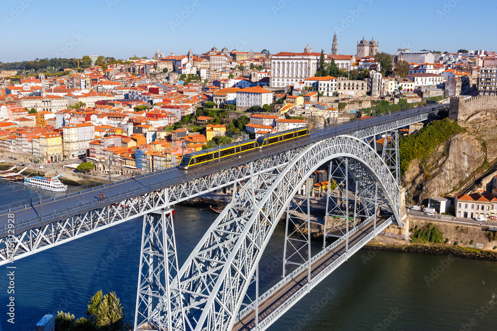 Porto Portugal with bridge Ponte Dom Luis I Douro river with tram town travel