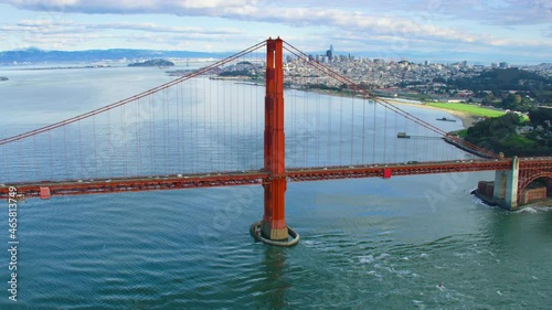 Aerial view of the Golden Gate Bridge San Francisco California. United States. It connects the San Francisco peninsula to Marin County. US route 101 and SR 1 full of cars. City skyline. photo