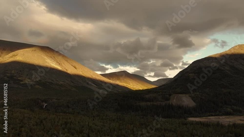 A magnificent view of morning sunlight illuminating the Khibiny mountains peaks  photo