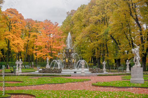 Beautiful autumn summer garden with fountains in St. Petersburg